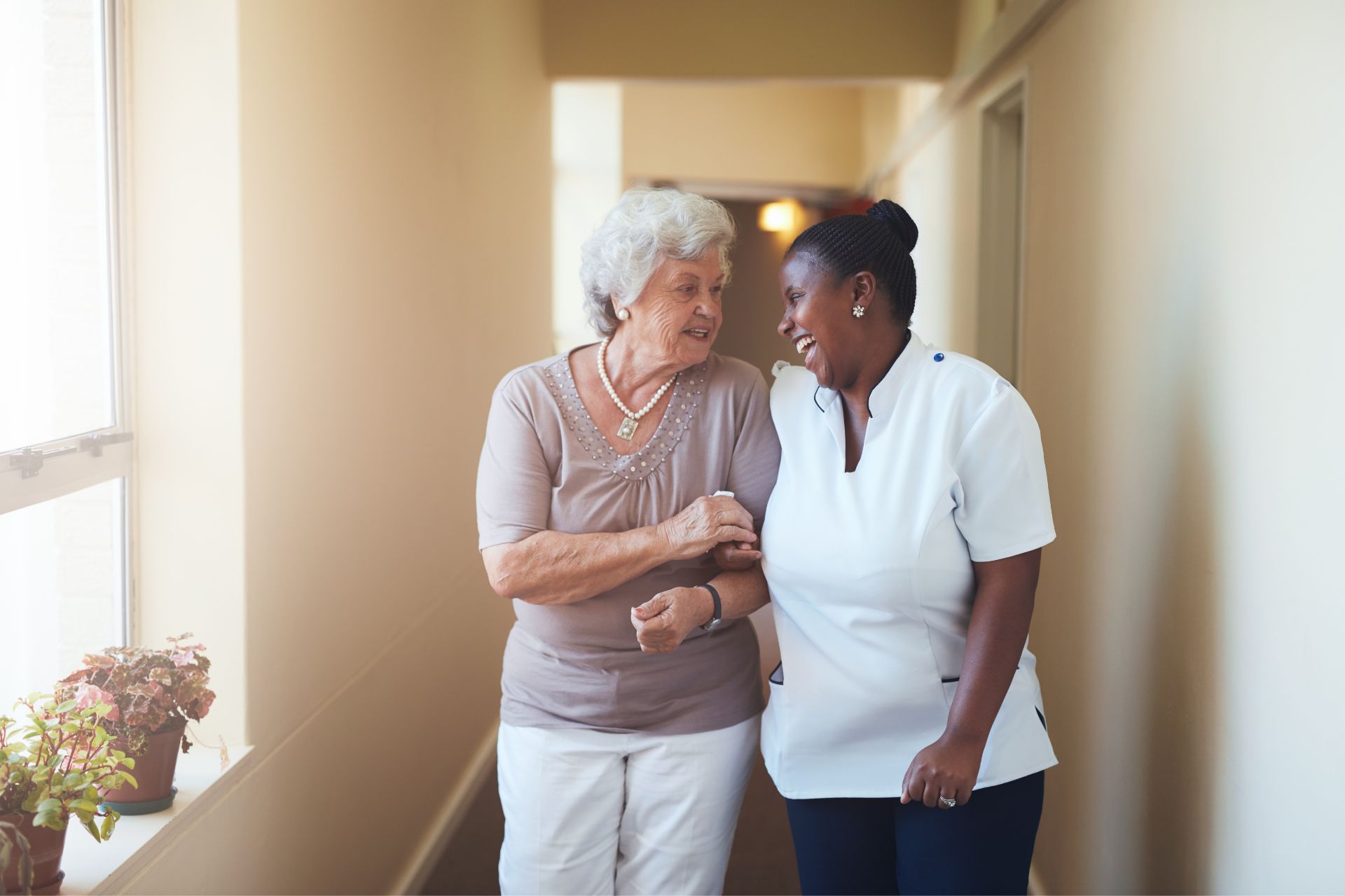 woman walking with caregiver