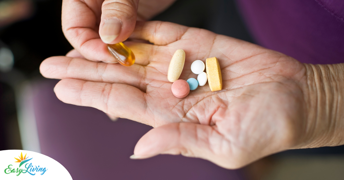 A woman holds pills in her hand, representing medication management.